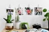 Four Square Prints are hung over a desk using silver skeleton clips.