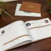 3 Family History Books are stacked up showing the 3 cover options - black or tan vegan leather and custom photo cover.