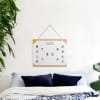A MyCanvas Family Tree Poster hangs over a bed, a daily reminder of the love of family.