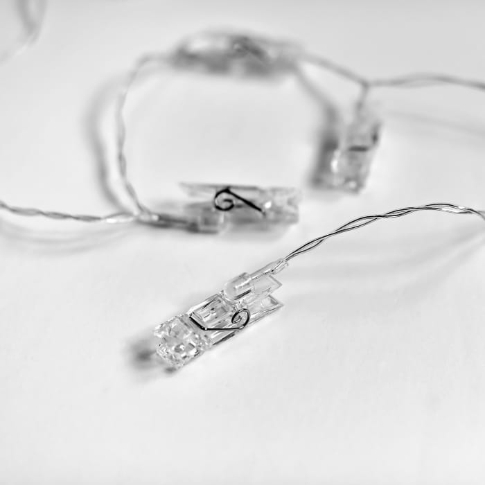 A closeup of one of the clothespin shaped LED clips on a string of Parabo Clip Lights.