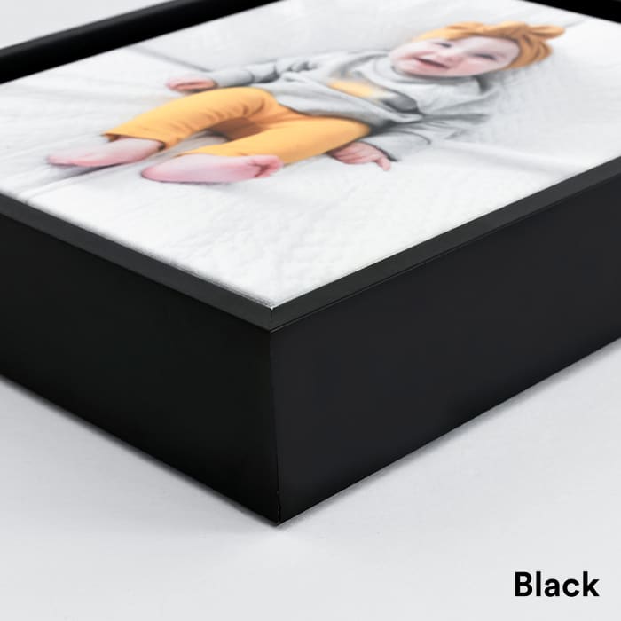 A closeup of the corner of a Black frame.
