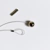 A closeup of the included magnets, end loop, and magntic ball of a Photo Rope.