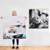 A person stands holding a Square Engineer Print. Another black and white print hangs on the wall behind them.