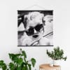 A portrait of a toddler as a black and white Square Engineer Print hangs from Black Poster Rails.