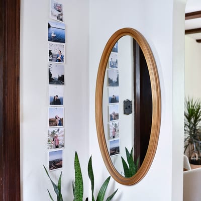Eight Square Photo Prints hang vertically on a magnetic Photo Rope in an entryway. Eight Square Photo Prints hang vertically on a magnetic Photo Rope in an entryway.