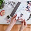 Hands holding a 4-inch Square Photo Print of a dad and baby, over a baby book.