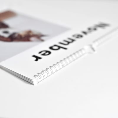 A closeup of the spiral binding of a custom photo Wall Calendar. A closeup of the spiral binding of a custom photo Wall Calendar.