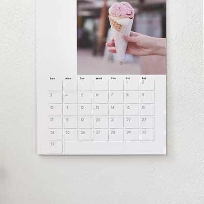 A closeup of an ice cream photo and dates on a 11x17 inch spiral bound Wall Calendar. A closeup of an ice cream photo and dates on a 11x17 inch spiral bound Wall Calendar.