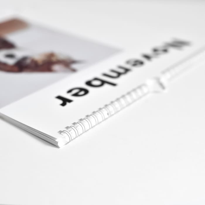 A closeup of the spiral binding of a custom photo Wall Calendar.
