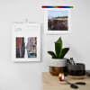 A custom Keepsake Wall Calendar displays vacation photos above a desk.