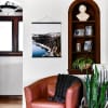 A matte Fine Art Print of a snowy vacation scene hangs from 20 inch Black Poster Rails.